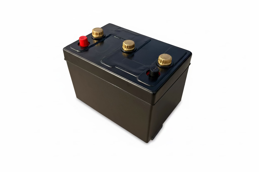 Car battery with tar topper and gold caps