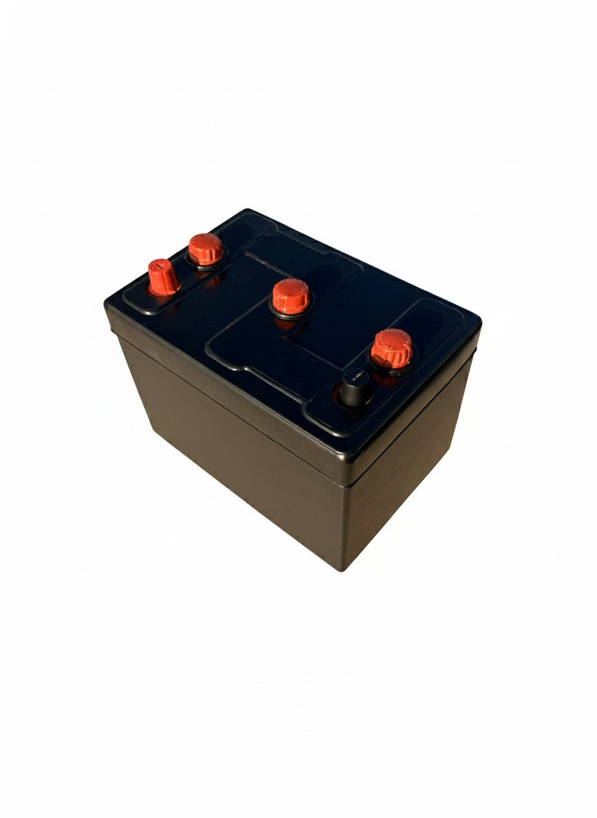 Car battery with a vintage cover on it to make it look retro. Red Caps. Works for 6-volt batteries. Tar Topper