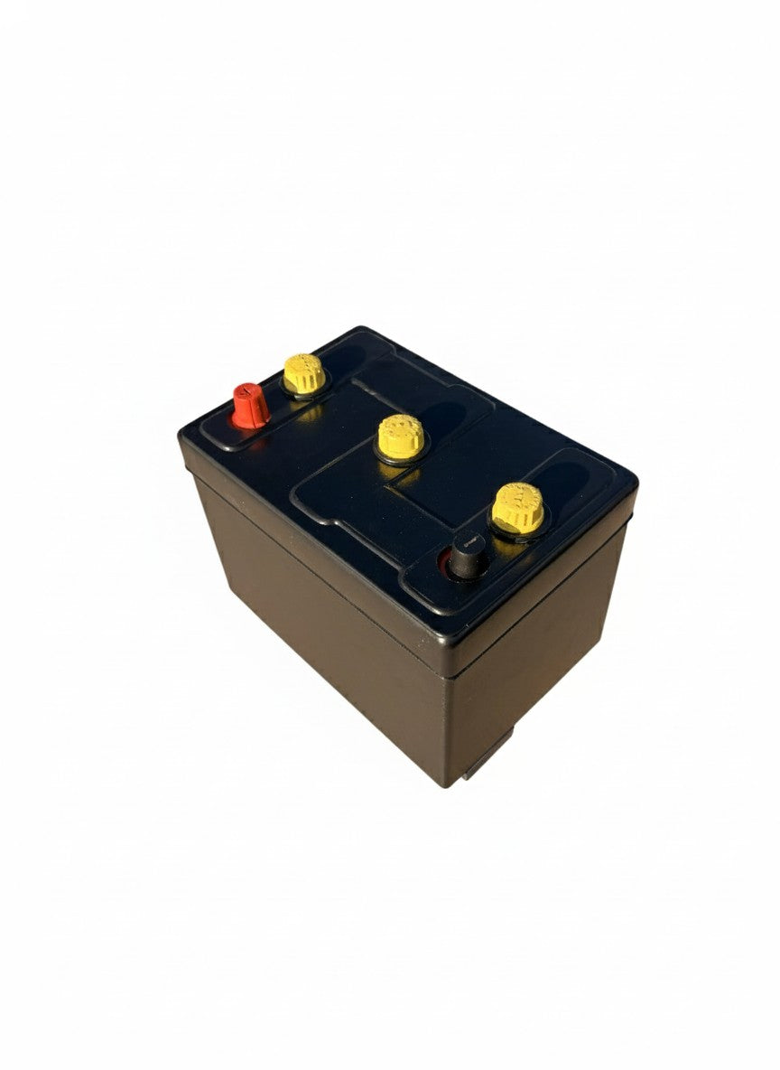 Car battery with a vintage cover on it to make it look retro. Yellow Caps. Works for 6-volt batteries. Tar Topper.